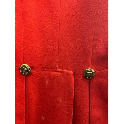 420 - A scarlet evening hunt jacket with tails and gilt buttons, satin lined, 110cm long, along with a sca... 