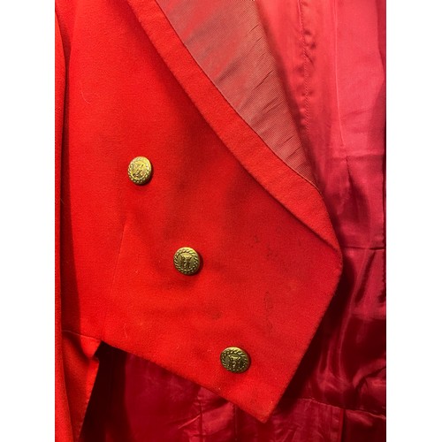 420 - A scarlet evening hunt jacket with tails and gilt buttons, satin lined, 110cm long, along with a sca... 