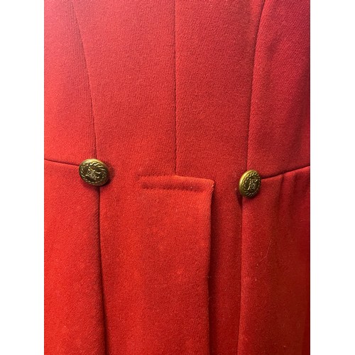 420 - A scarlet evening hunt jacket with tails and gilt buttons, satin lined, 110cm long, along with a sca... 