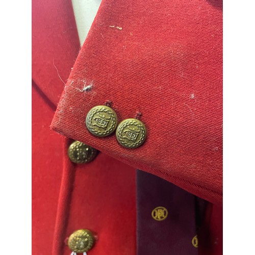 420 - A scarlet evening hunt jacket with tails and gilt buttons, satin lined, 110cm long, along with a sca... 