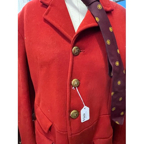 420 - A scarlet evening hunt jacket with tails and gilt buttons, satin lined, 110cm long, along with a sca... 