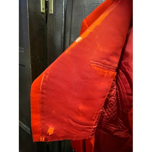 420 - A scarlet evening hunt jacket with tails and gilt buttons, satin lined, 110cm long, along with a sca... 