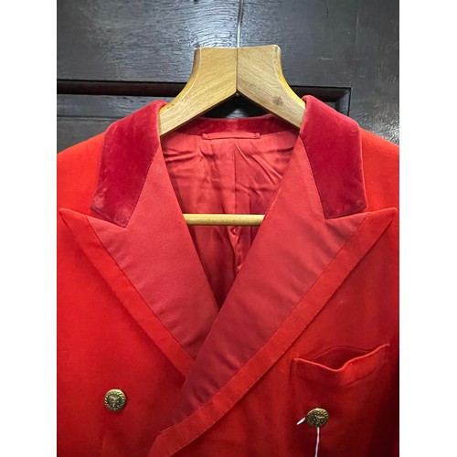 420 - A scarlet evening hunt jacket with tails and gilt buttons, satin lined, 110cm long, along with a sca... 