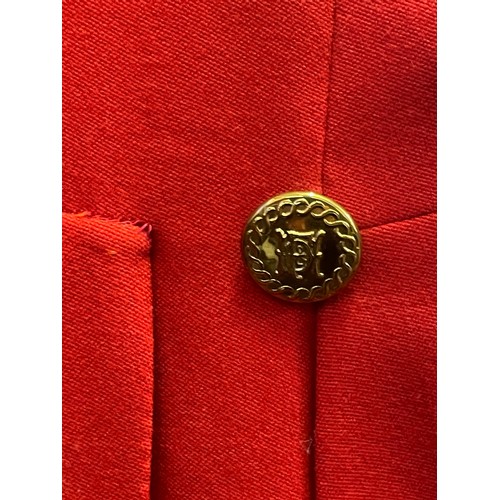 420 - A scarlet evening hunt jacket with tails and gilt buttons, satin lined, 110cm long, along with a sca... 