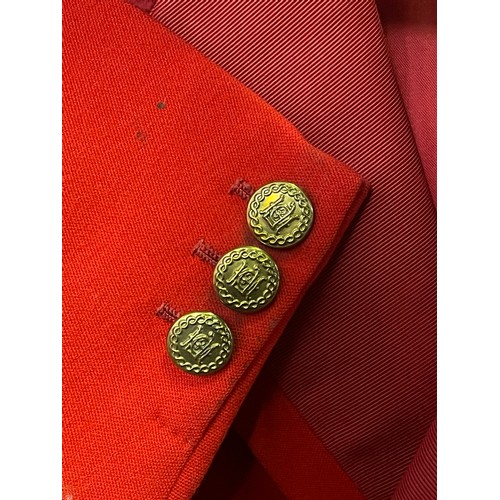 420 - A scarlet evening hunt jacket with tails and gilt buttons, satin lined, 110cm long, along with a sca... 