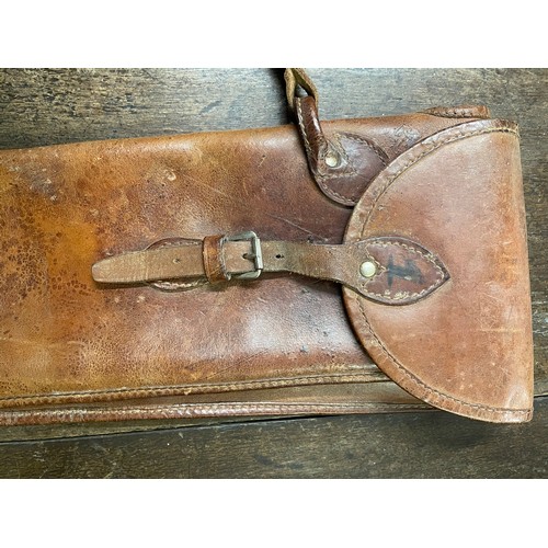 430 - A leather cartridge bag by Payne & Gallway, of typical form with brass fittings and canvas shoulder ... 