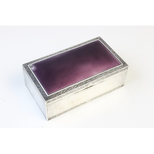 124 - A French silver and enamel cigarette box by Paul Guillon, of rectangular form, purple enamel to engi... 