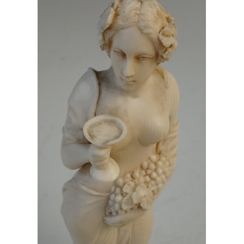 393 - A late 19th century Dieppe carved ivory bacchanalian figure, possibly a Maenad, modelled as a scanti... 