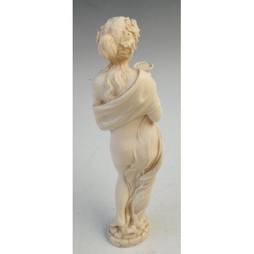 393 - A late 19th century Dieppe carved ivory bacchanalian figure, possibly a Maenad, modelled as a scanti... 