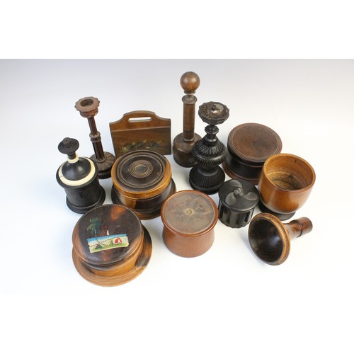 363 - An extensive collection of treen pieces, 19th century and later, to include turned lidded and open v... 