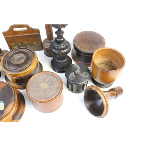 363 - An extensive collection of treen pieces, 19th century and later, to include turned lidded and open v... 