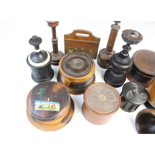 363 - An extensive collection of treen pieces, 19th century and later, to include turned lidded and open v... 