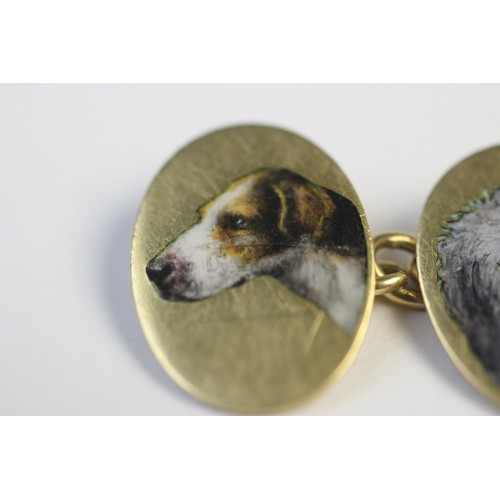 221 - A pair of 18ct gold enamelled cufflinks by Cropp & Farr, each oval panel depicting the head of a dog... 