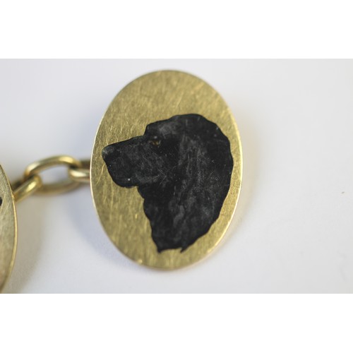 221 - A pair of 18ct gold enamelled cufflinks by Cropp & Farr, each oval panel depicting the head of a dog... 