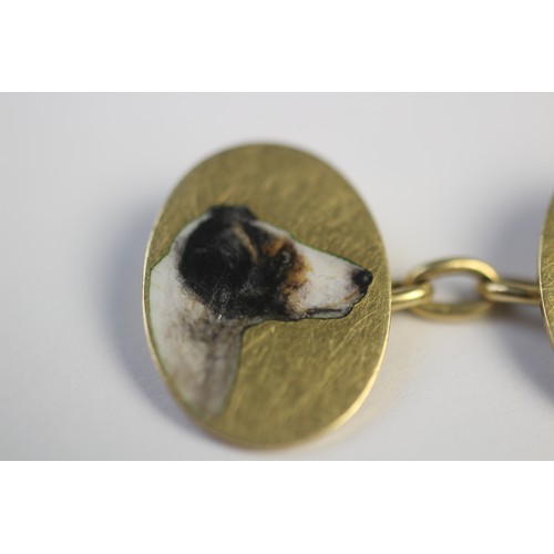 221 - A pair of 18ct gold enamelled cufflinks by Cropp & Farr, each oval panel depicting the head of a dog... 