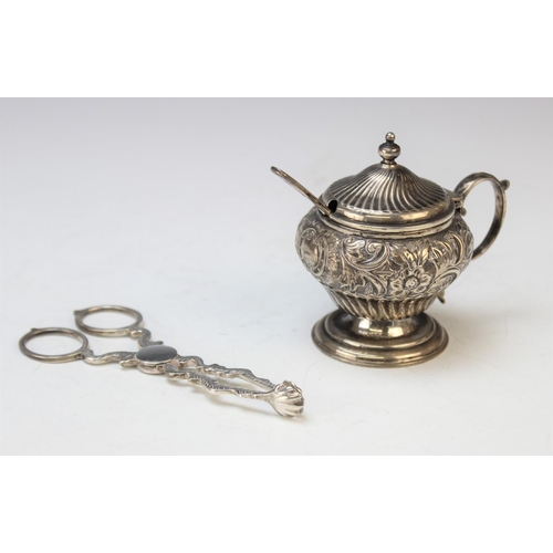 101 - A Victorian silver mustard pot by L Spiers, Birmingham 1892, of baluster form with embossed floral d... 