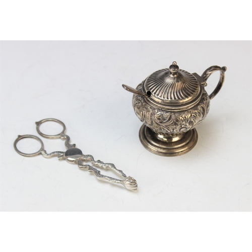 101 - A Victorian silver mustard pot by L Spiers, Birmingham 1892, of baluster form with embossed floral d... 