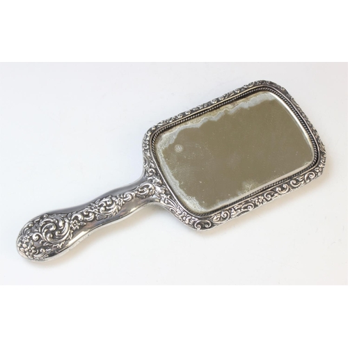 102 - An Edwardian silver mounted mirror by Henry Matthews, Birmingham 1901, of rectangular form with embo... 