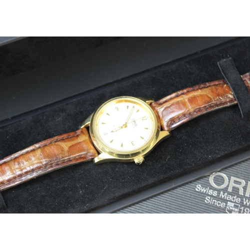 123 - A Gentleman's Oris Swiss Automatic wristwatch, the stainless steel gold tone case enclosing a circul... 