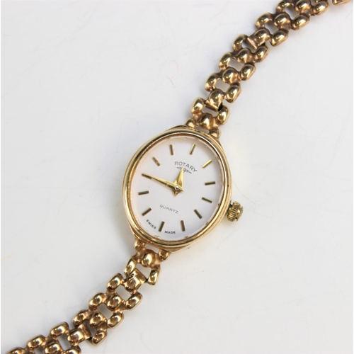 130 - A Lady's 9ct gold Rotary wristwatch, the white oval dial with baton markers, set to a plain polished... 