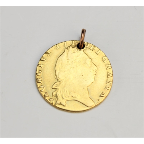 136 - A George III spade back guinea, dated 1798 (pierced pendant loop), gross weight 8.35gms