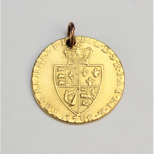 136 - A George III spade back guinea, dated 1798 (pierced pendant loop), gross weight 8.35gms