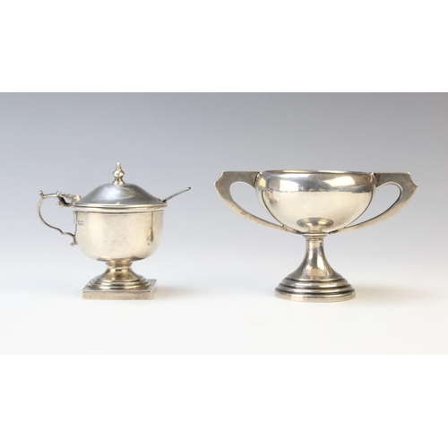 20 - An Art Deco miniature silver twin-handled trophy by Emile Viner, Sheffield 1934, of compressed form ... 