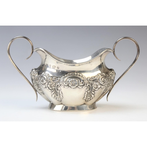 21 - An Edwardian twin-handled silver sugar bowl by Joseph Gloster, Birmingham 1901, of oval form with sh... 