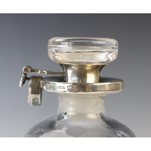33 - A George V glass and silver locking decanter by Asprey & Co Ltd, Birmingham 1932, of square form dec... 