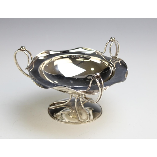 34 - An Art Nouveau silver tazza by Hukin & Heath, Birmingham 1906,of circular form with shaped rim with ... 