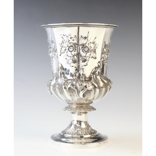 45 - A William IV silver chalice, London 1834, of pedestal form and later embossed with foliate decoratio... 