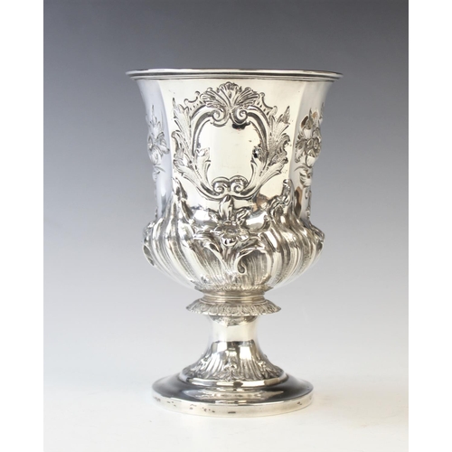 45 - A William IV silver chalice, London 1834, of pedestal form and later embossed with foliate decoratio... 