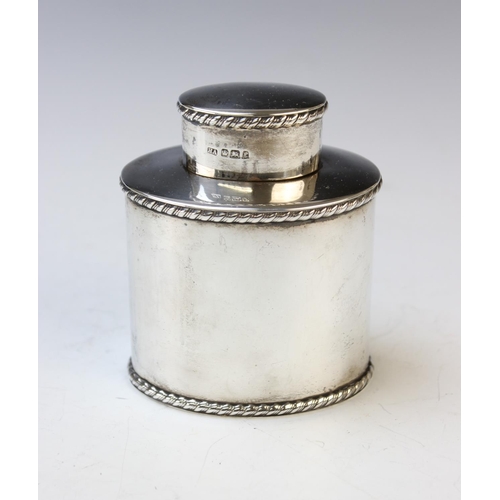 49 - A silver tea caddy and cover, Atkin Brothers, Sheffield 1897, of oval form and with rope twist borde... 