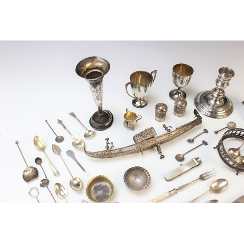 54 - A selection of silver and plated wares, to include; a silver candlestick, William Comyns and Sons, L... 