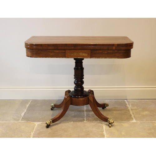 552 - A George IV brass inlaid rosewood pedestal card table, the folding top inlaid with a frieze of brass... 