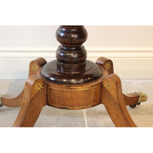 552 - A George IV brass inlaid rosewood pedestal card table, the folding top inlaid with a frieze of brass... 