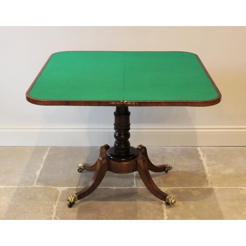 552 - A George IV brass inlaid rosewood pedestal card table, the folding top inlaid with a frieze of brass... 