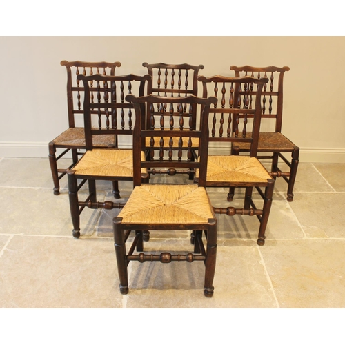 557 - A harlequin set of seven oak, ash and beech Lancashire spindle back kitchen chairs, 18th/19th centur... 