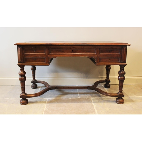 567 - A Louis XV style walnut desk, late 19th century, the rectangular moulded top inset with a leather sk... 