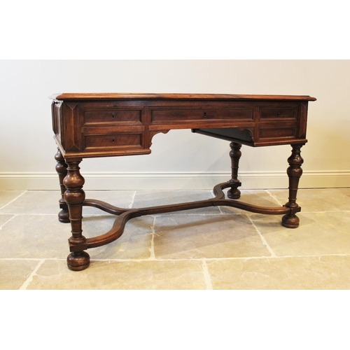 567 - A Louis XV style walnut desk, late 19th century, the rectangular moulded top inset with a leather sk... 