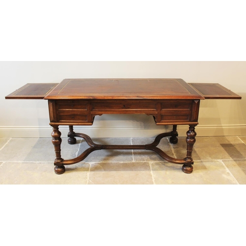 567 - A Louis XV style walnut desk, late 19th century, the rectangular moulded top inset with a leather sk... 