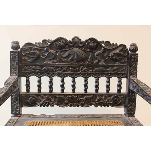 580 - A Dutch colonial Ceylonese ebony armchair, Coromandel coast, 18th/19th century, with carved lotus ba... 