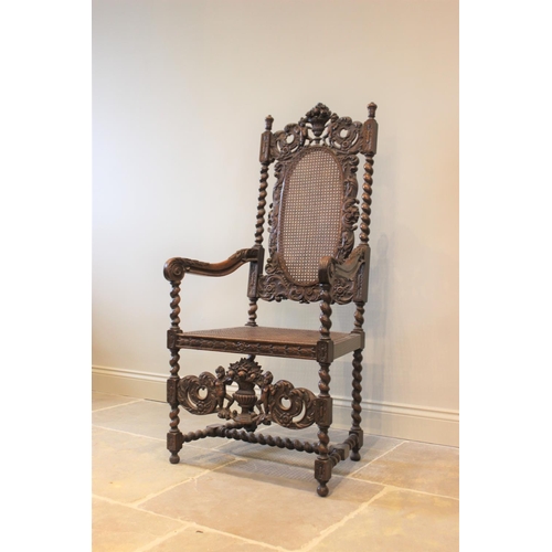 581 - A 19th century Carolean style carver chair, carved with floral bouquets flanked by cherubs, with ber... 