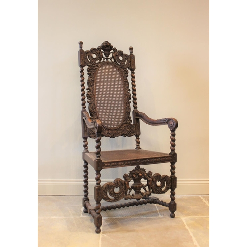 581 - A 19th century Carolean style carver chair, carved with floral bouquets flanked by cherubs, with ber... 