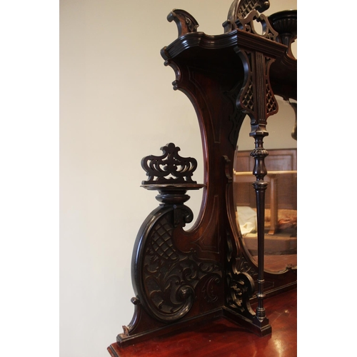 582 - A late Victorian mahogany mirror back chiffoniere, of serpentine form with an oval mirror back above... 