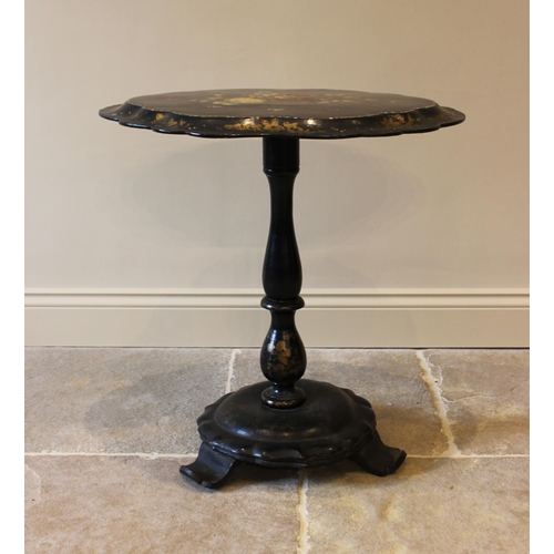 586 - A Victorian papier mache pedestal occasional table, the oval tilt top with a scalloped rim, centred ... 