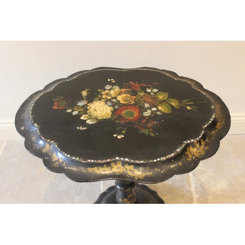 586 - A Victorian papier mache pedestal occasional table, the oval tilt top with a scalloped rim, centred ... 