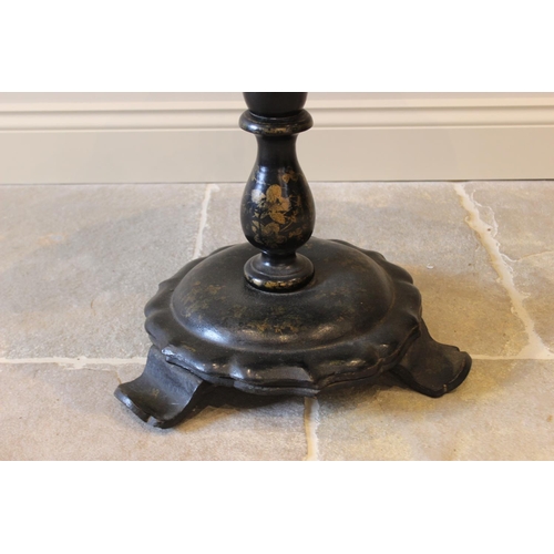 586 - A Victorian papier mache pedestal occasional table, the oval tilt top with a scalloped rim, centred ... 