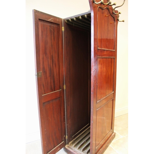 589 - A mid 19th century mahogany leaf store, combined with a hall stand, the serpentine side panel mounte... 