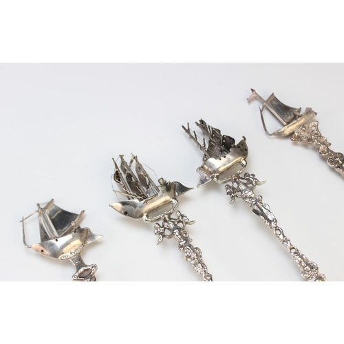 59 - Three Dutch silver spoons, each designed with pictorial bowl depicting harbour, lock and light house... 